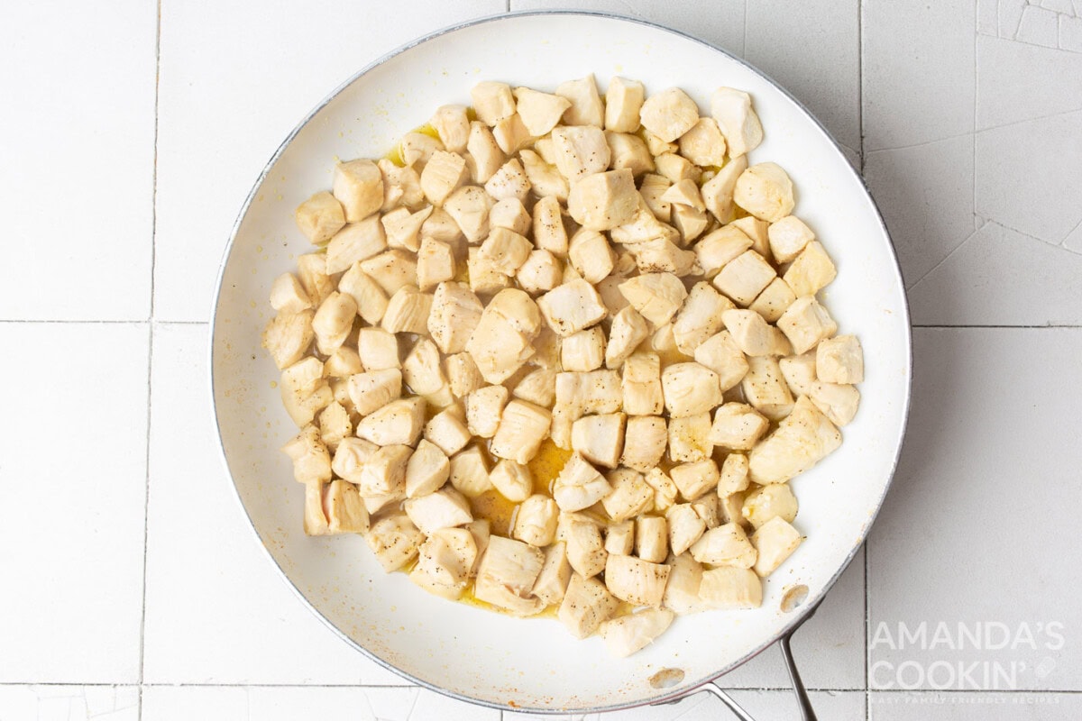 cubed chicken in a skillet