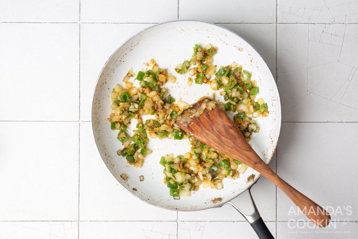 garlic onion and pepper sauteeing in a skillet