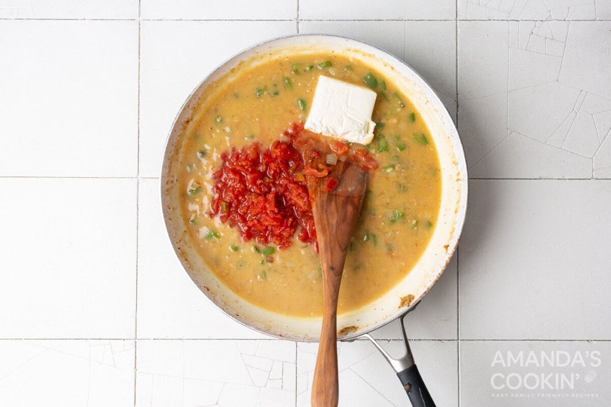 chicken broth, rotel tomatoes, and cream cheese in skillet