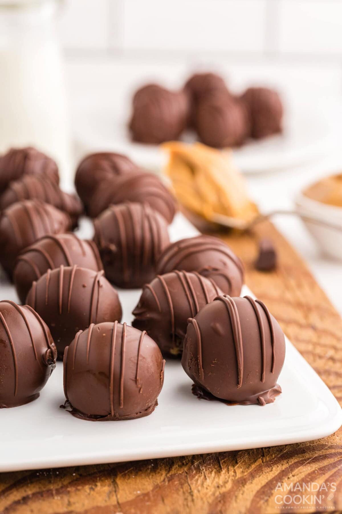 white cutting board with Chocolate Peanut Butter Balls