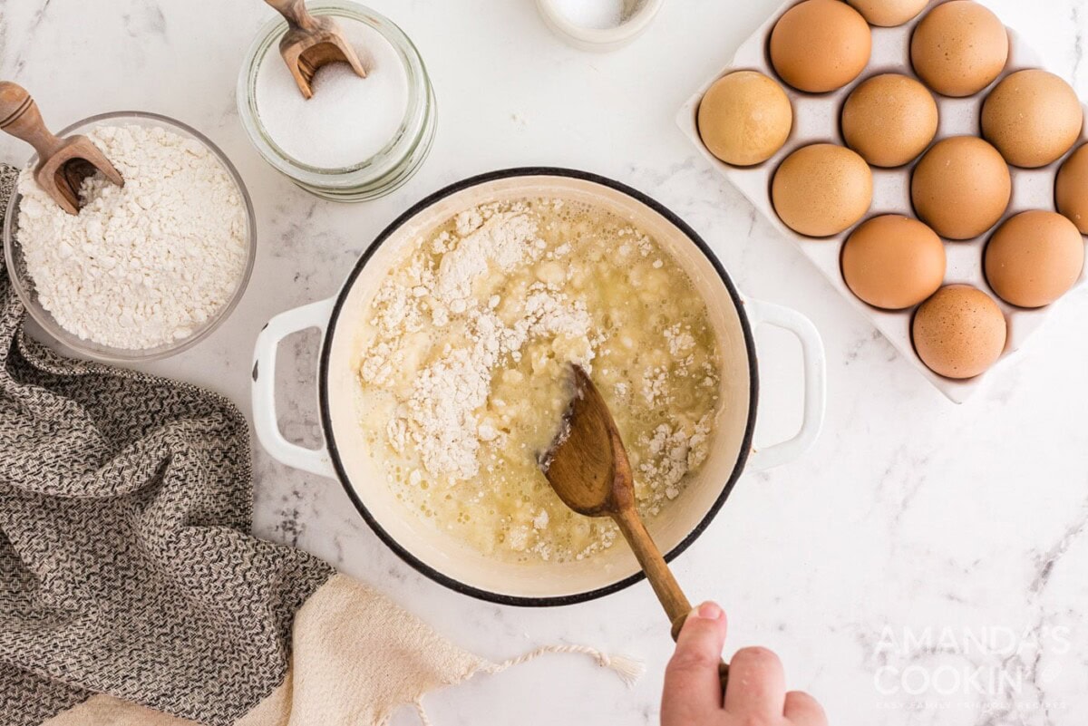 stirring flour into butter mixture in saucepan