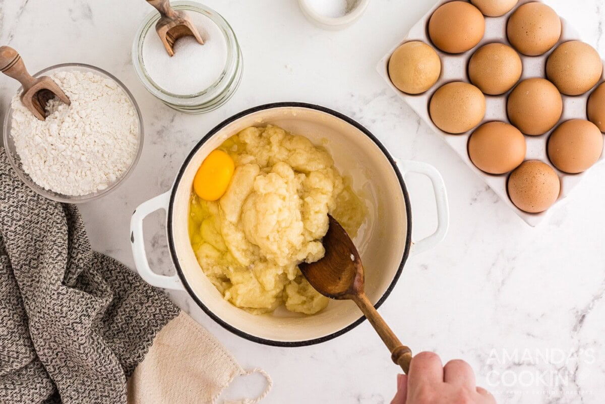 stirring egg into dough mixture
