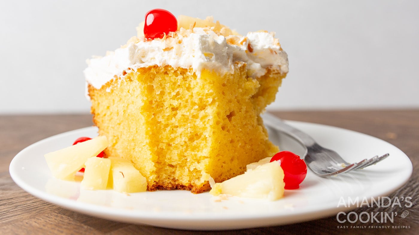Juicy pineapple meets cake mix for a super simple poke cake recipe, great for all sorts of occasions
