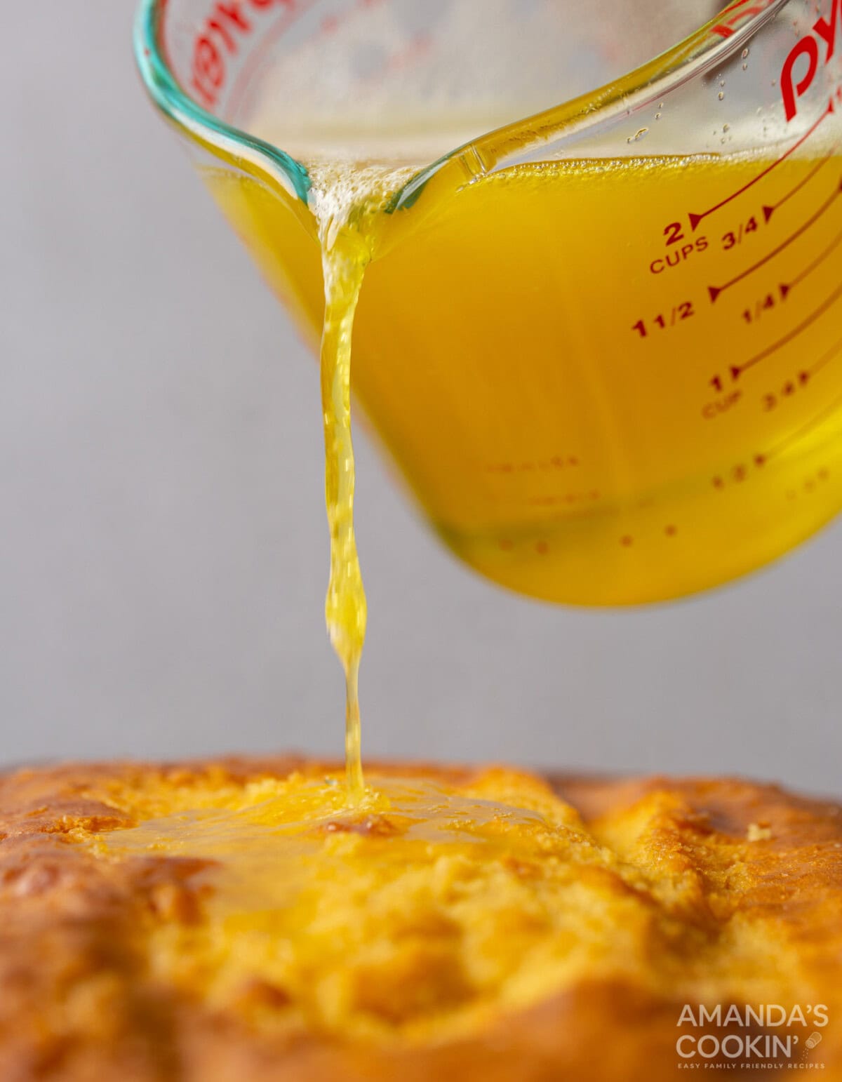 pouring jello over cake