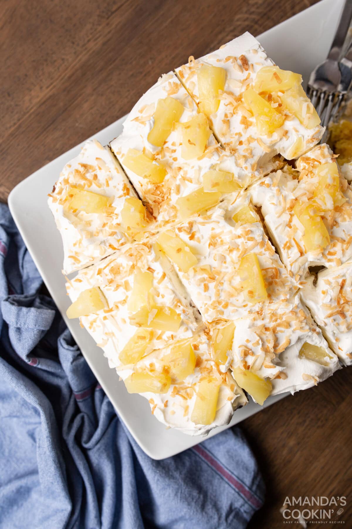 pineapple cake with pineapple garnish cut into slices