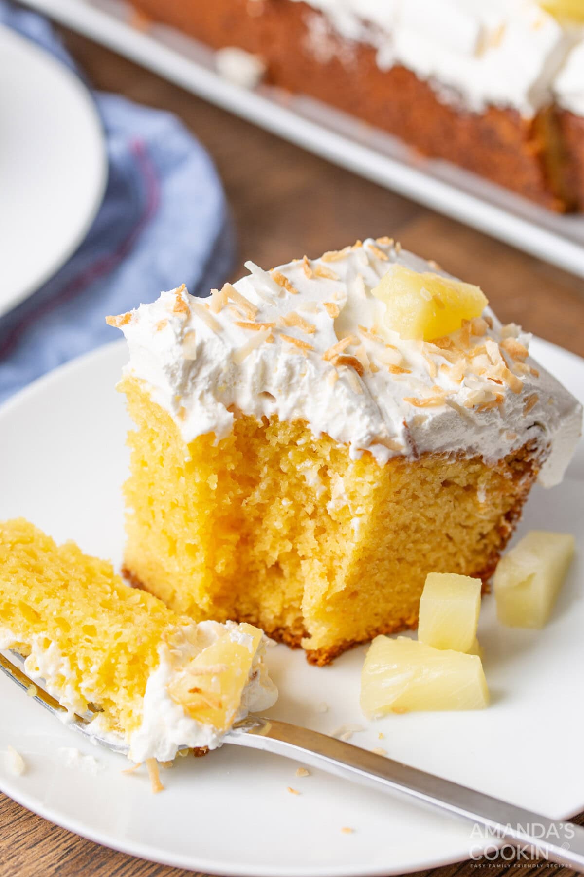 slice of pineapple poke cake
