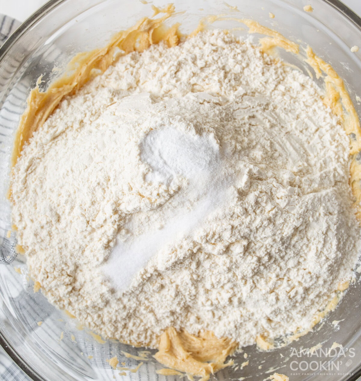 flour and baking powder on top of cookie dough