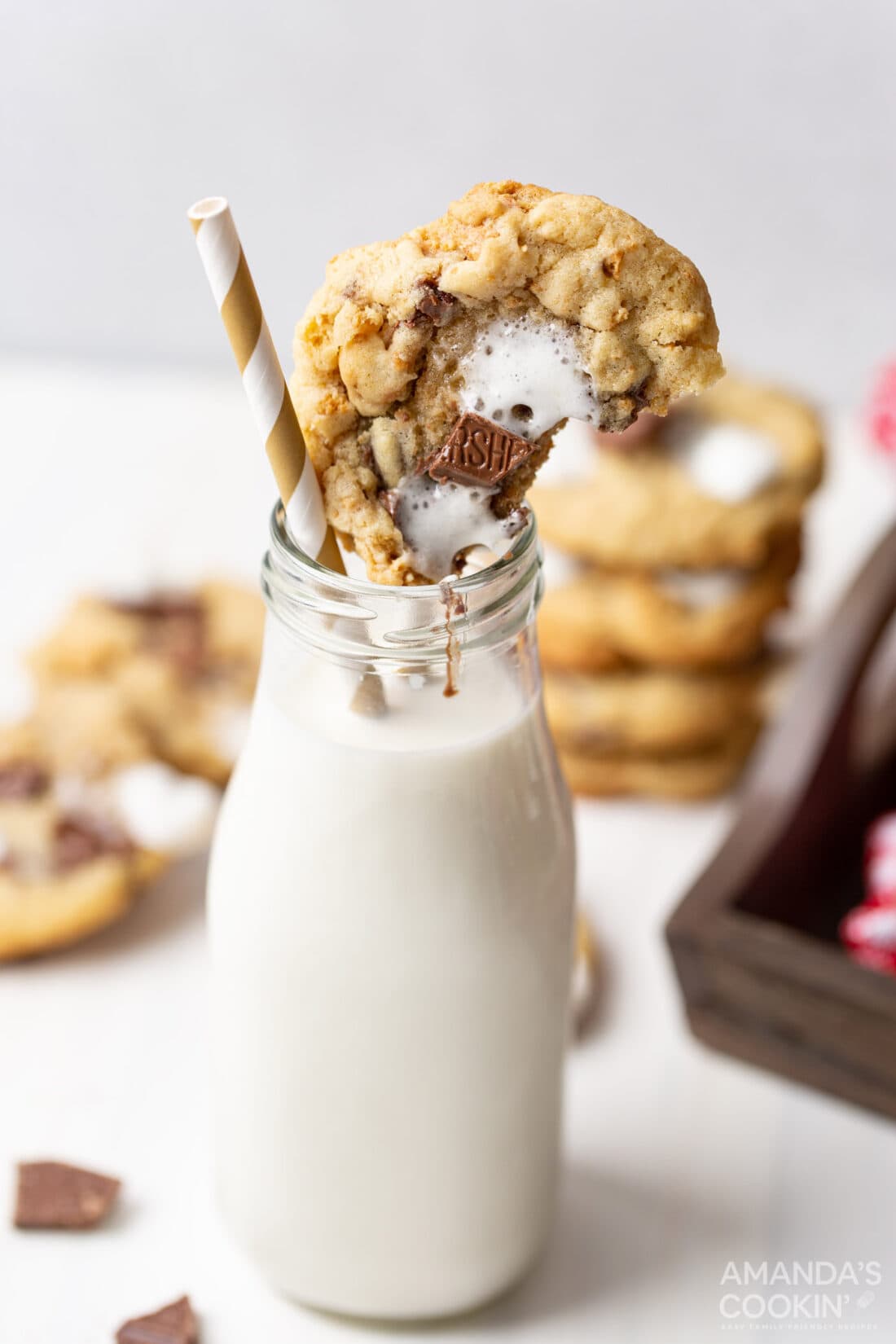 bottle of milk with smores cookie on top