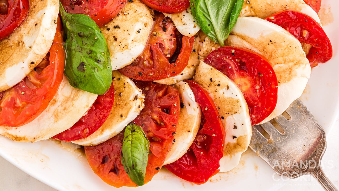 Fresh mozzarella, juicy tomatoes, and basil leaves drizzled with a balsamic-olive oil dressing.