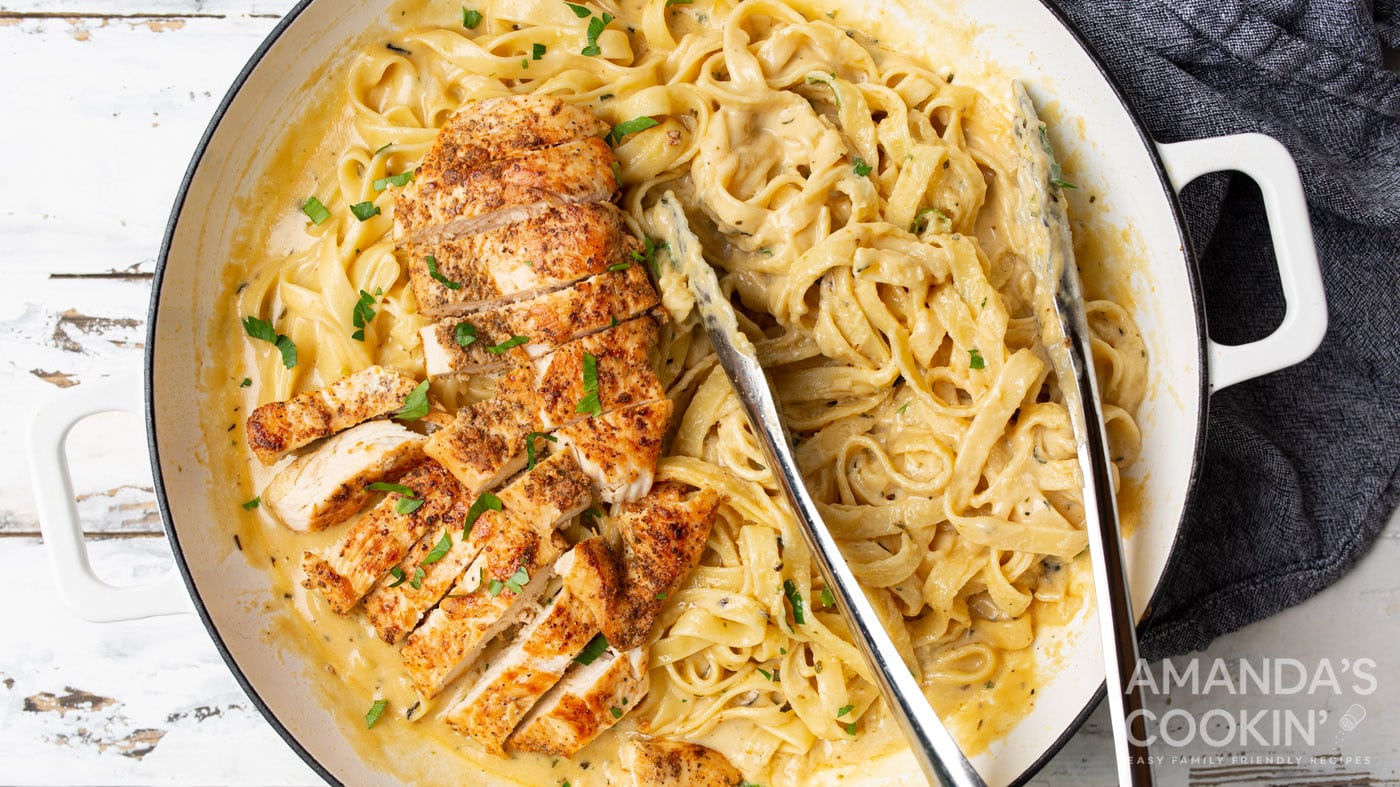 Golden brown pan-seared chicken paired with rich cheesy alfredo and fettuccine noodles all seasoned 