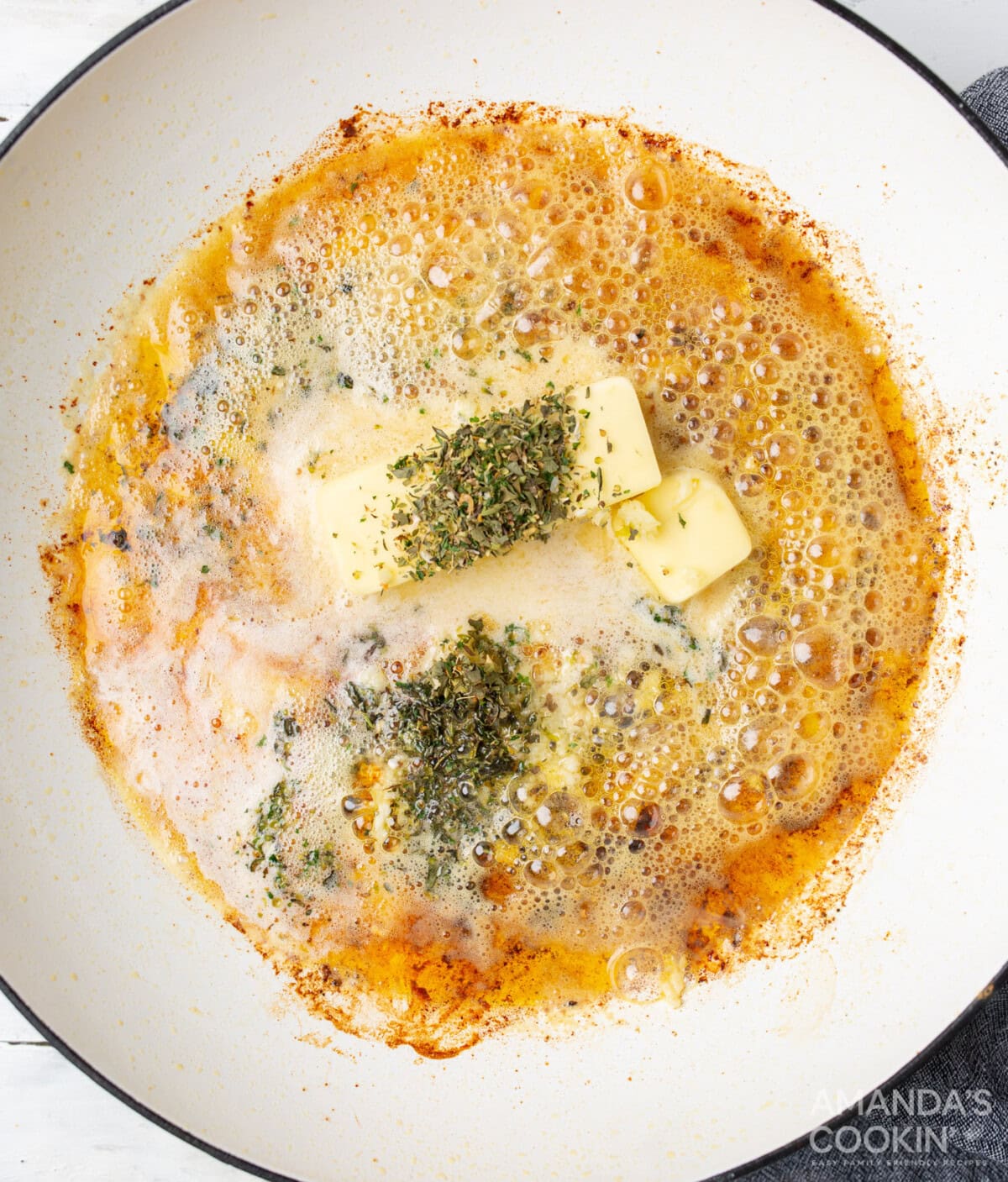 butter and seasoning for alfredo in a skillet