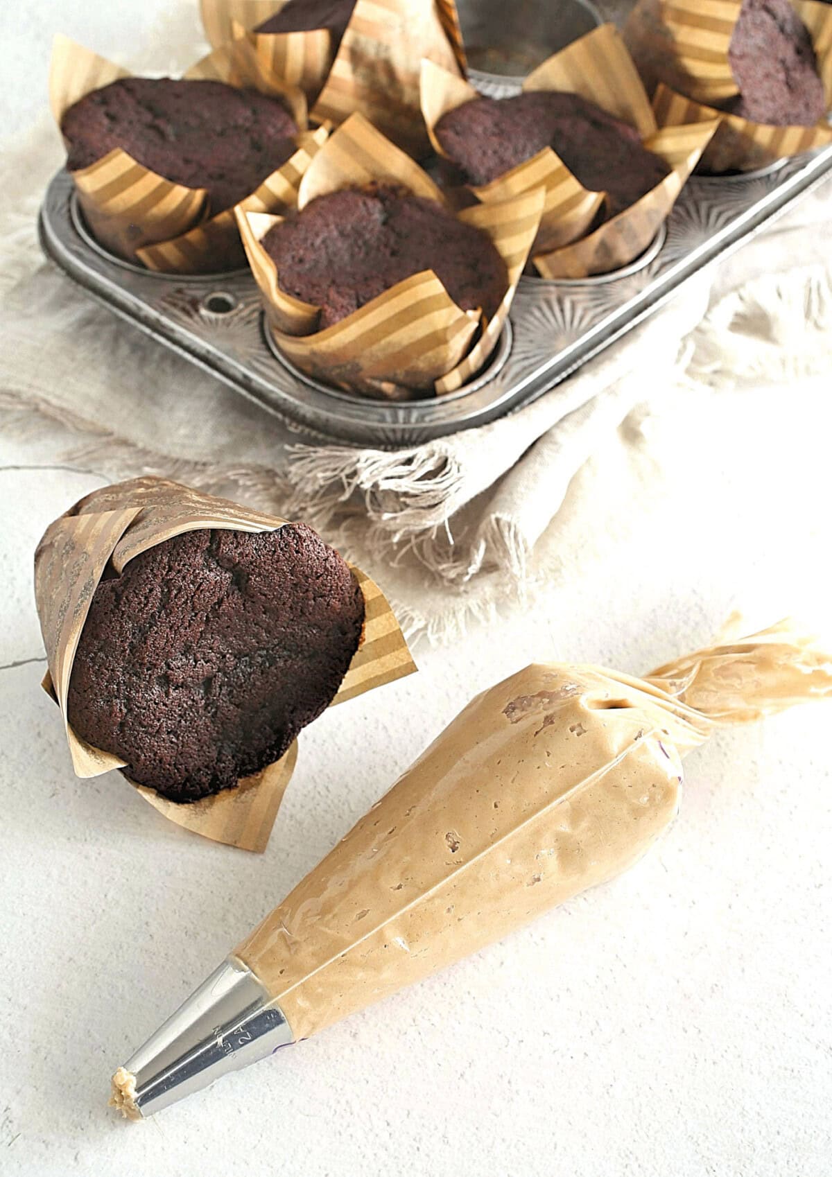chocolate cupcake with peanut butter frosting in a bag