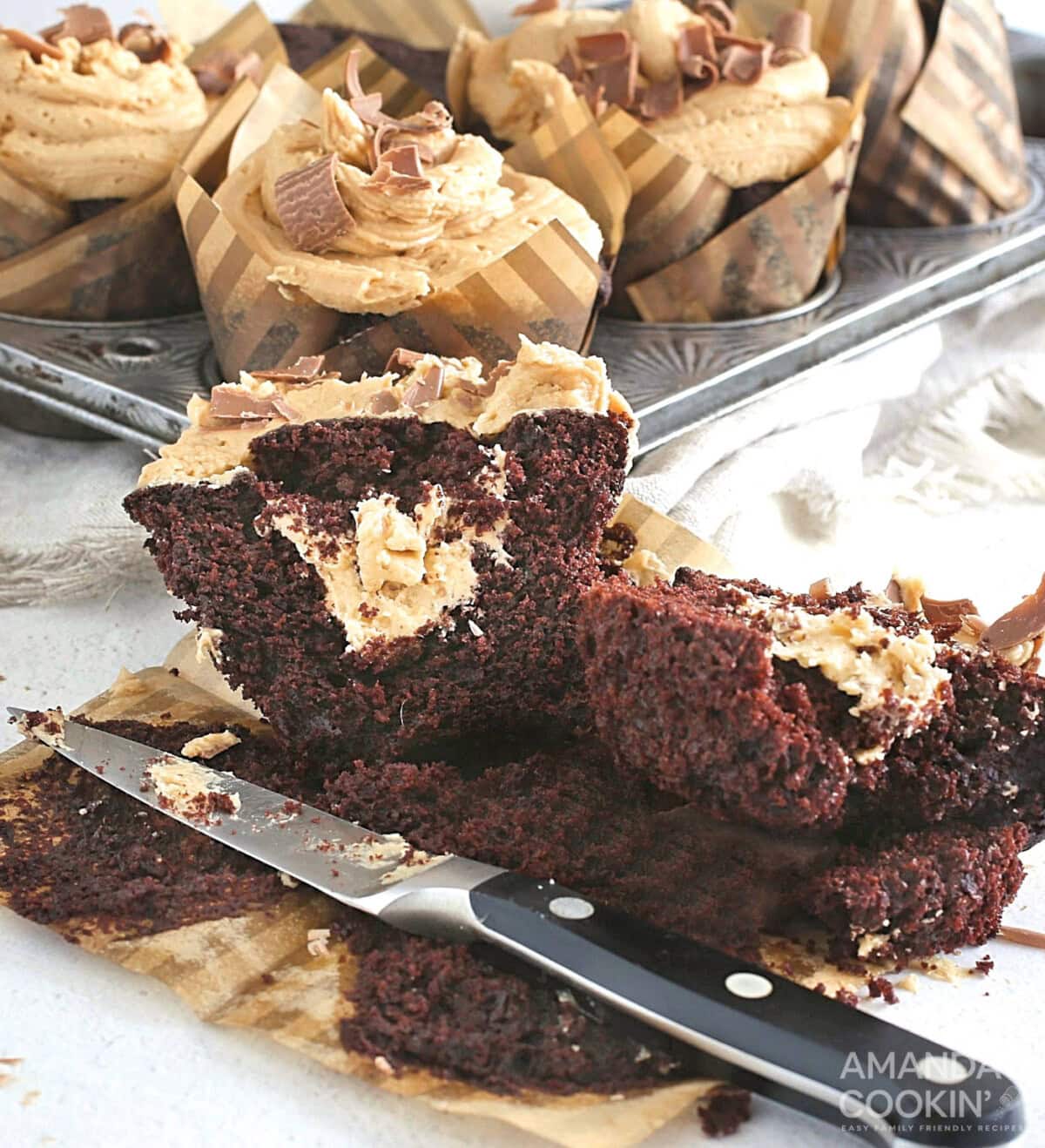 Chocolate Peanut Butter Cupcake cut open to reveal peanut butter filling
