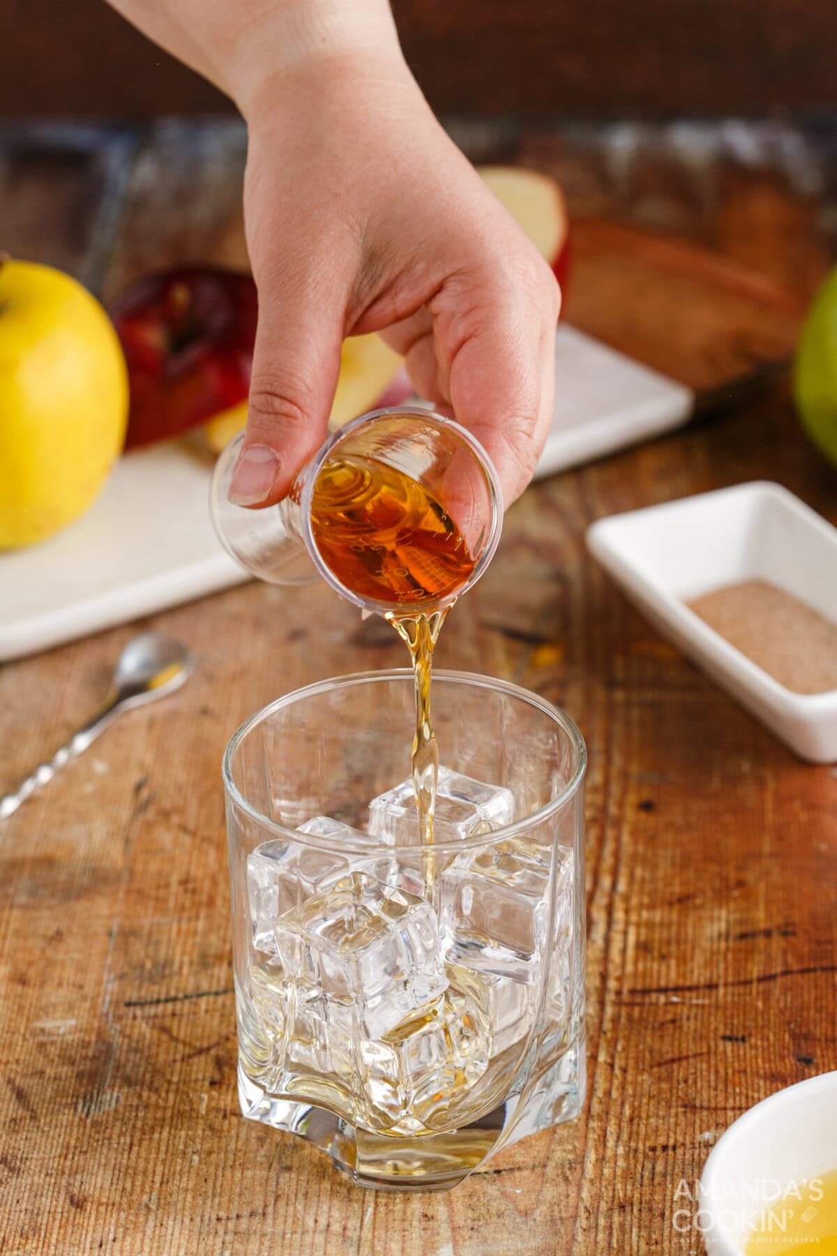pouring fireball whiskey into a shot glass