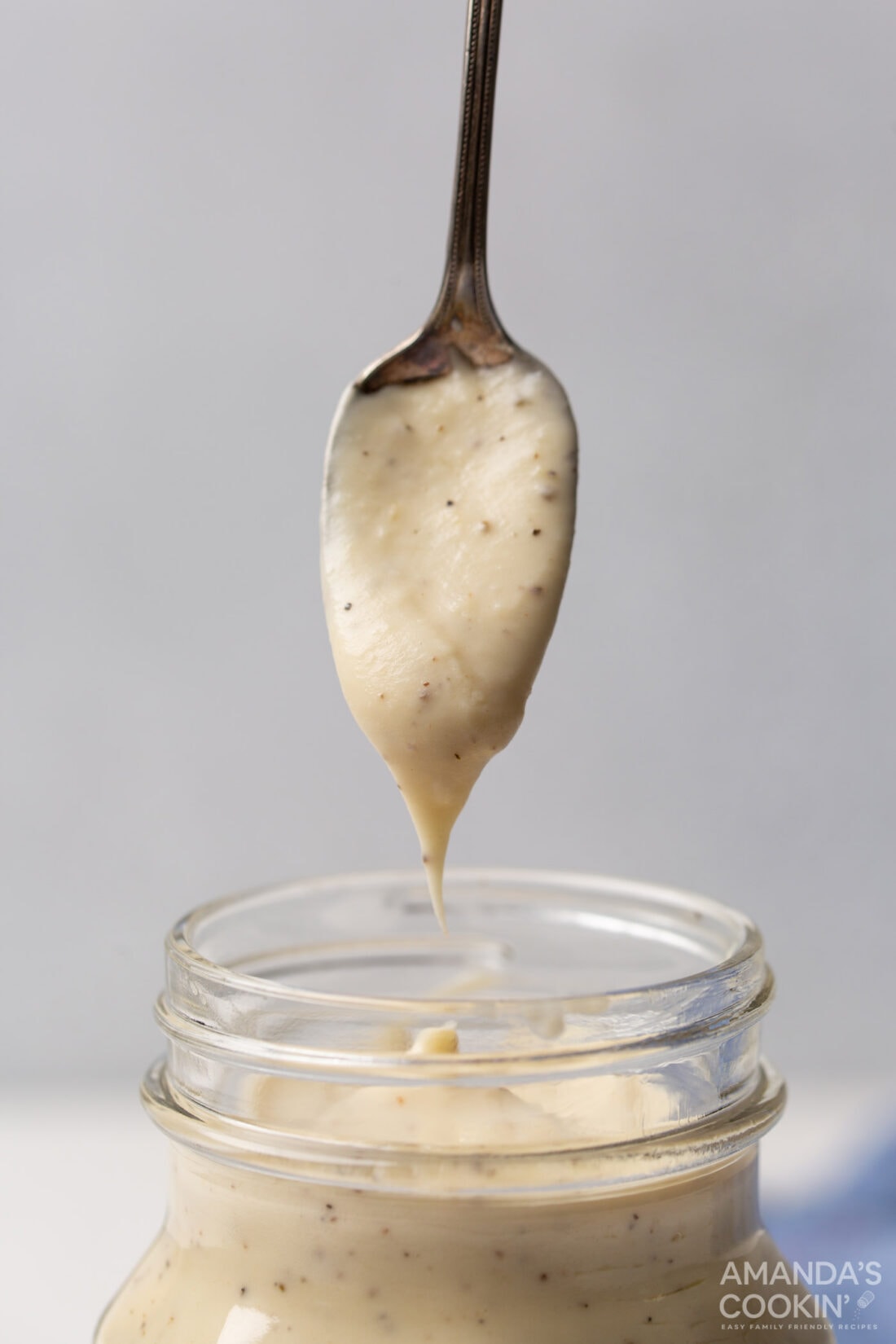 spoon coming out of jar of Homemade Cream of Chicken Soup