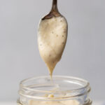 spoon coming out of jar of Homemade Cream of Chicken Soup