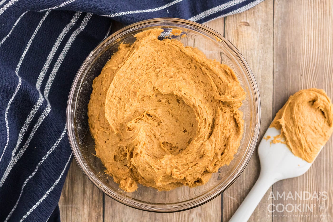 pumpkin puree mixed with cake mix in a bowl