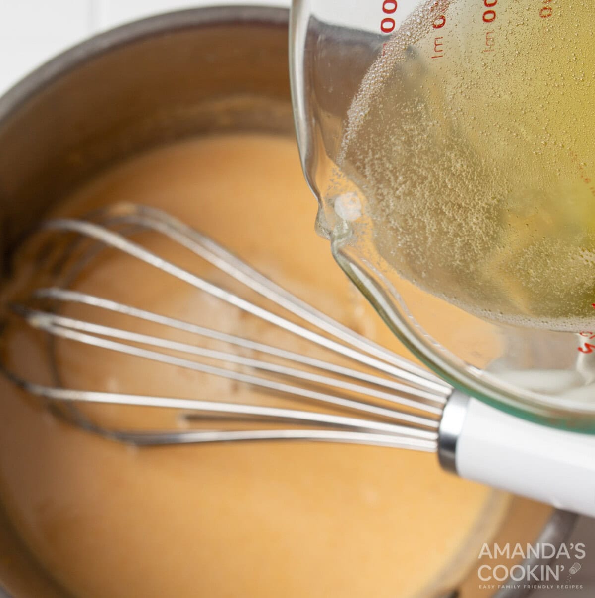 pouring beer into roux
