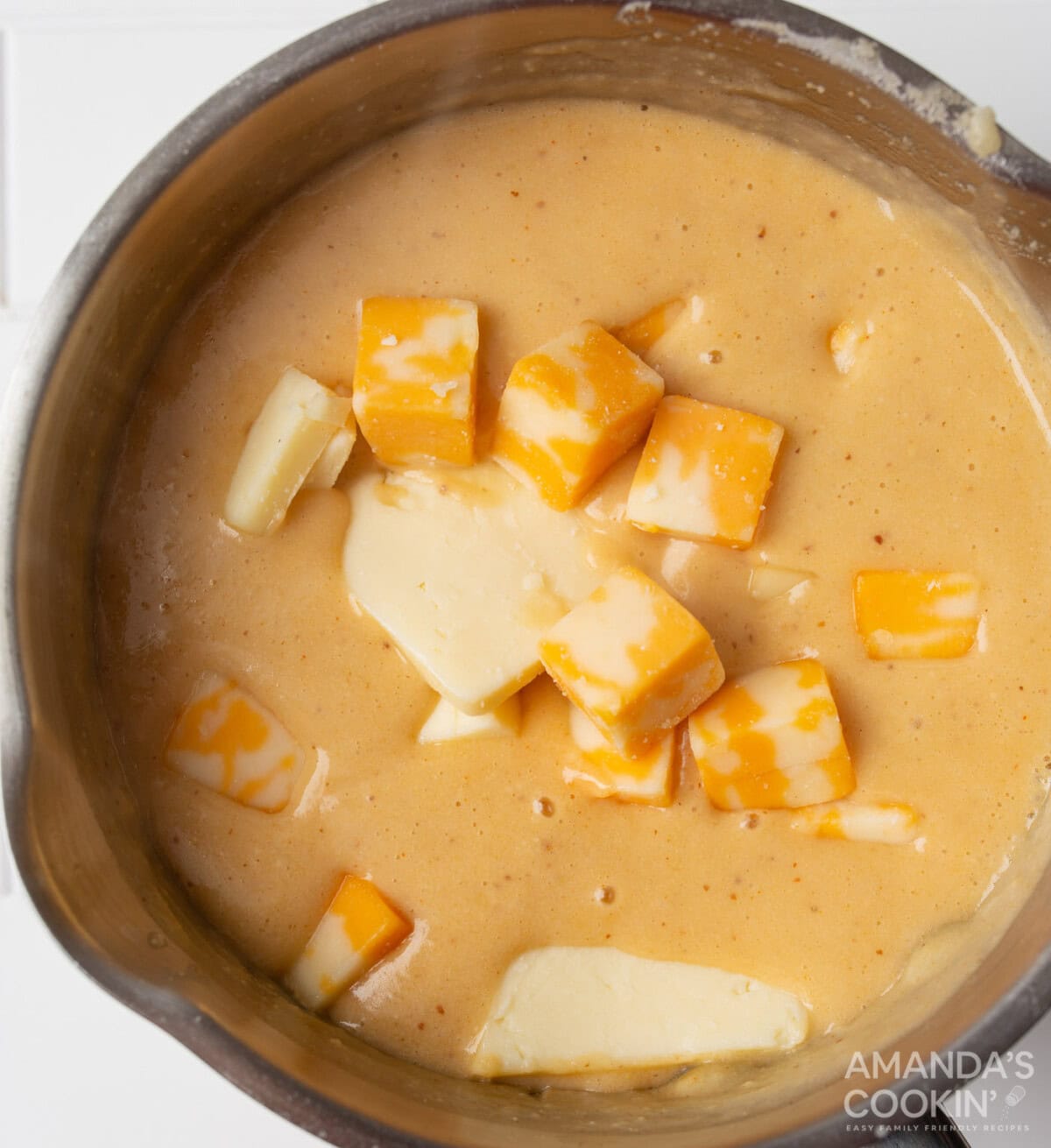 cubed cheese in butter and beer roux