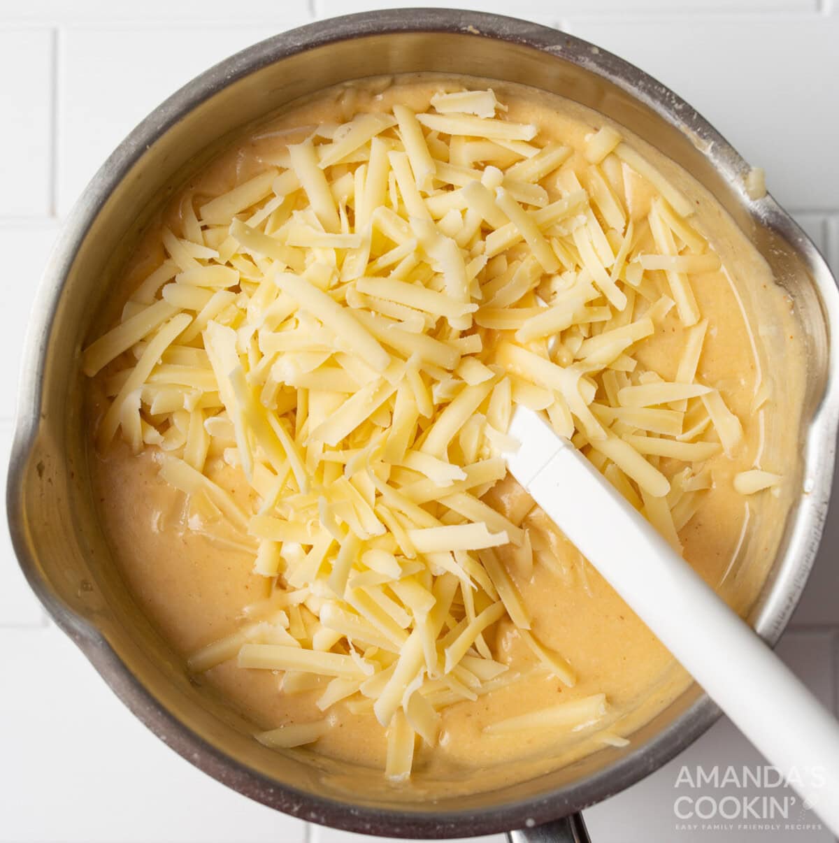 shredded cheese in beer cheese dip