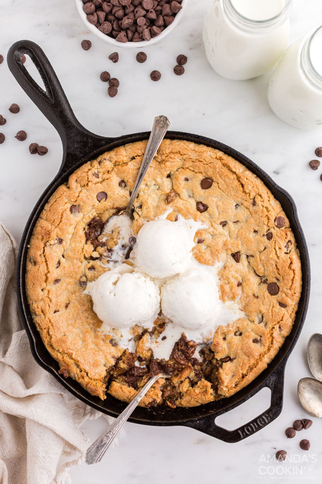 chocolate chip cookie in a skillet with vanilla ice cream