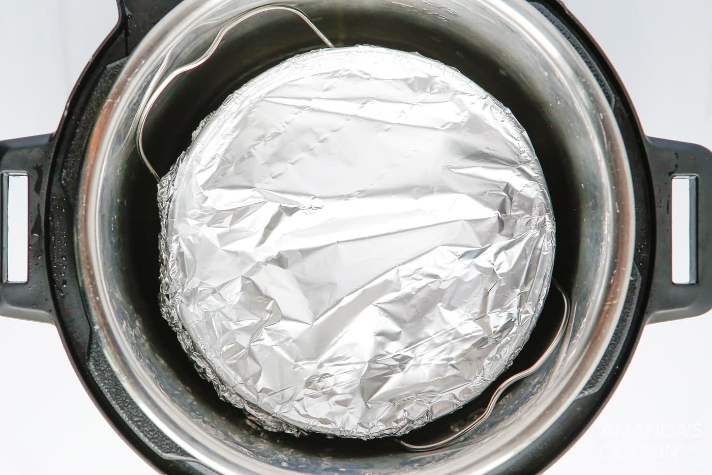 cheesecake wrapped in aluminum foil in the instant pot