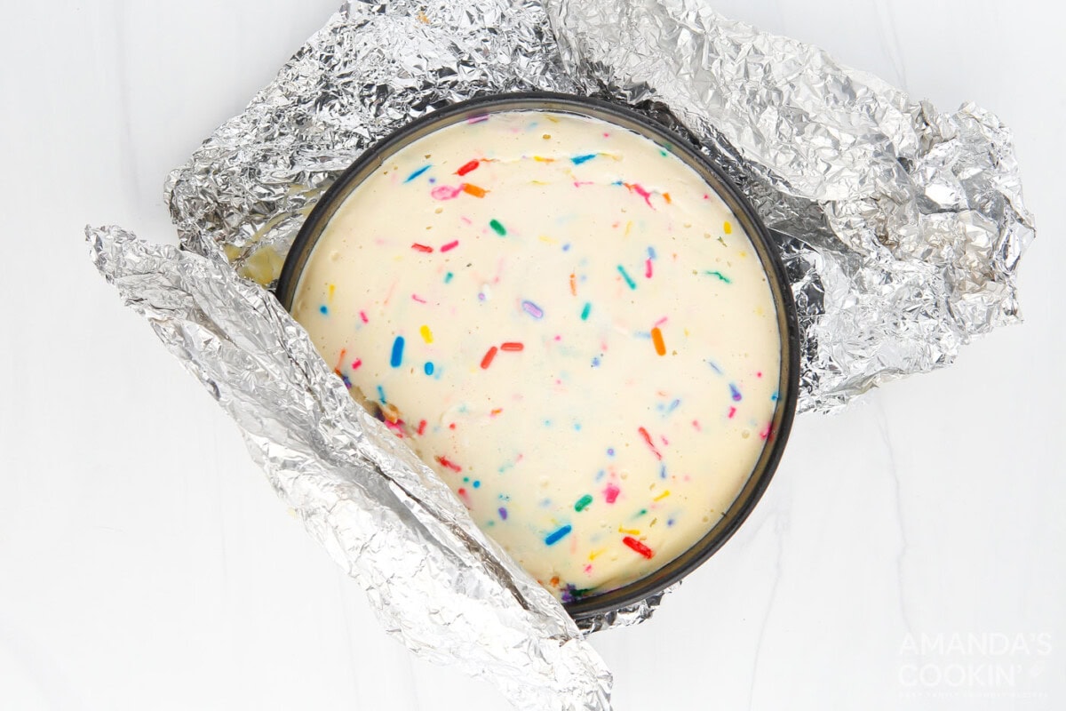 unwrapping funfetti cheesecake