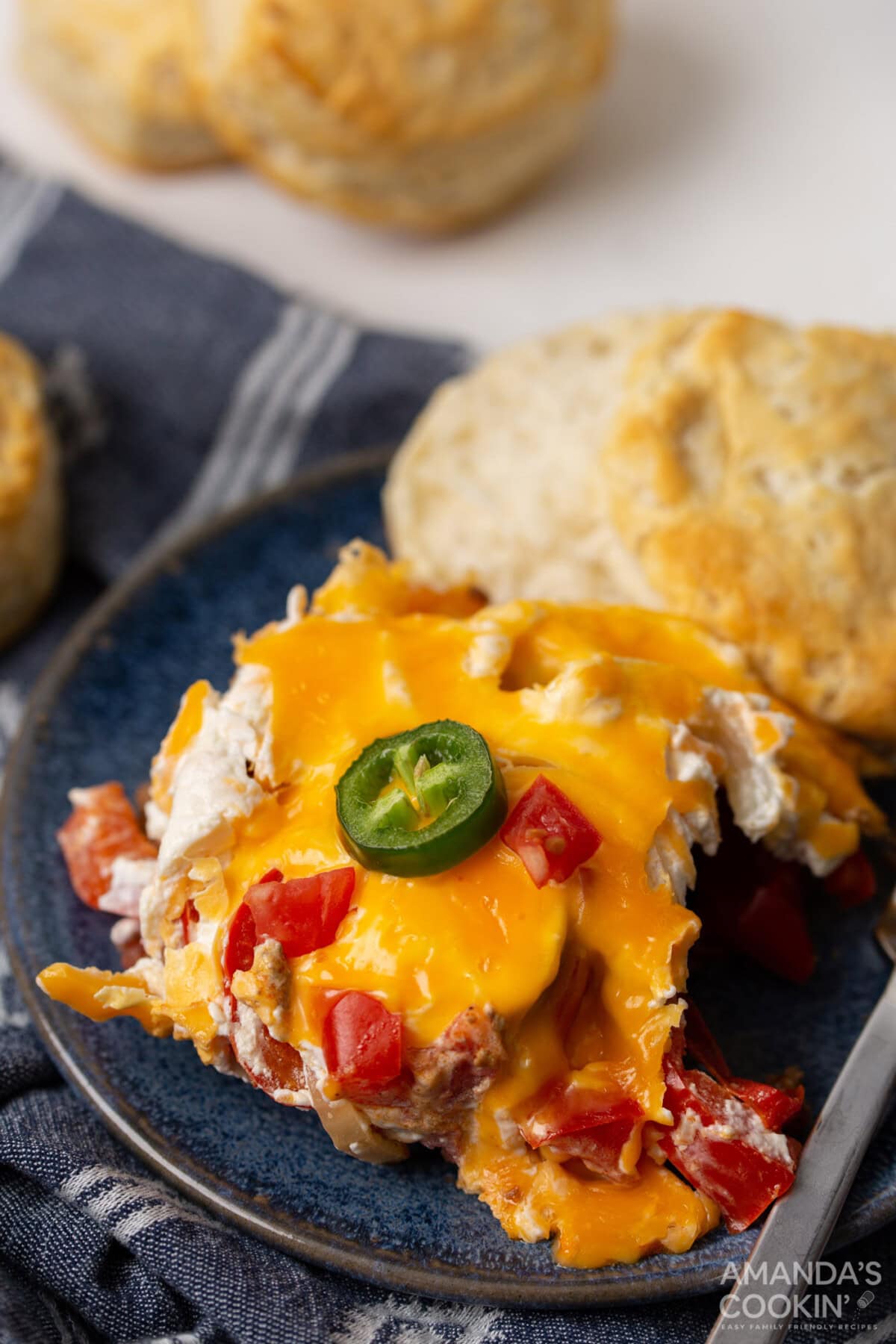 crockpot john wayne casserole with a biscuit on a plate