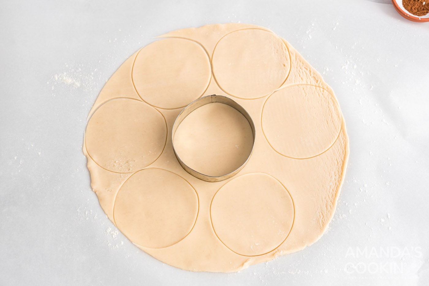 cookie cutter cutting into pie crust