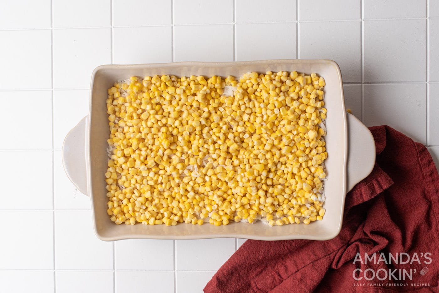 corn on top of rice in casserole dish