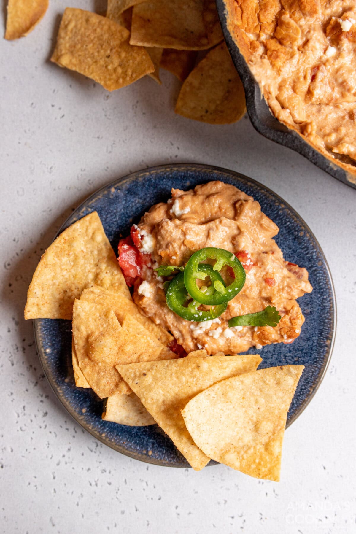 Bean Dip on a plate with cihps