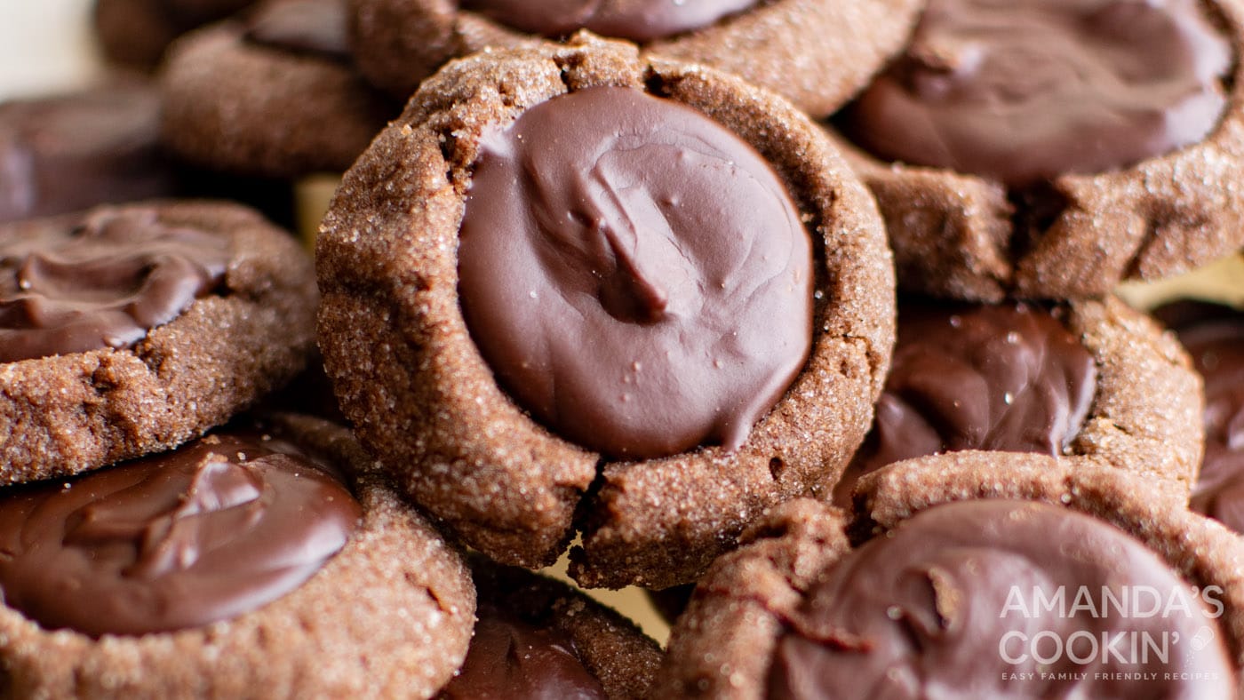 These thumbprint cookies feature a silky smooth chocolate filling puddled inside a soft cookie base 