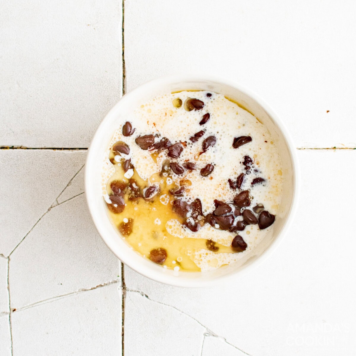 heavy cream and butter in a bowl of chocolate chips