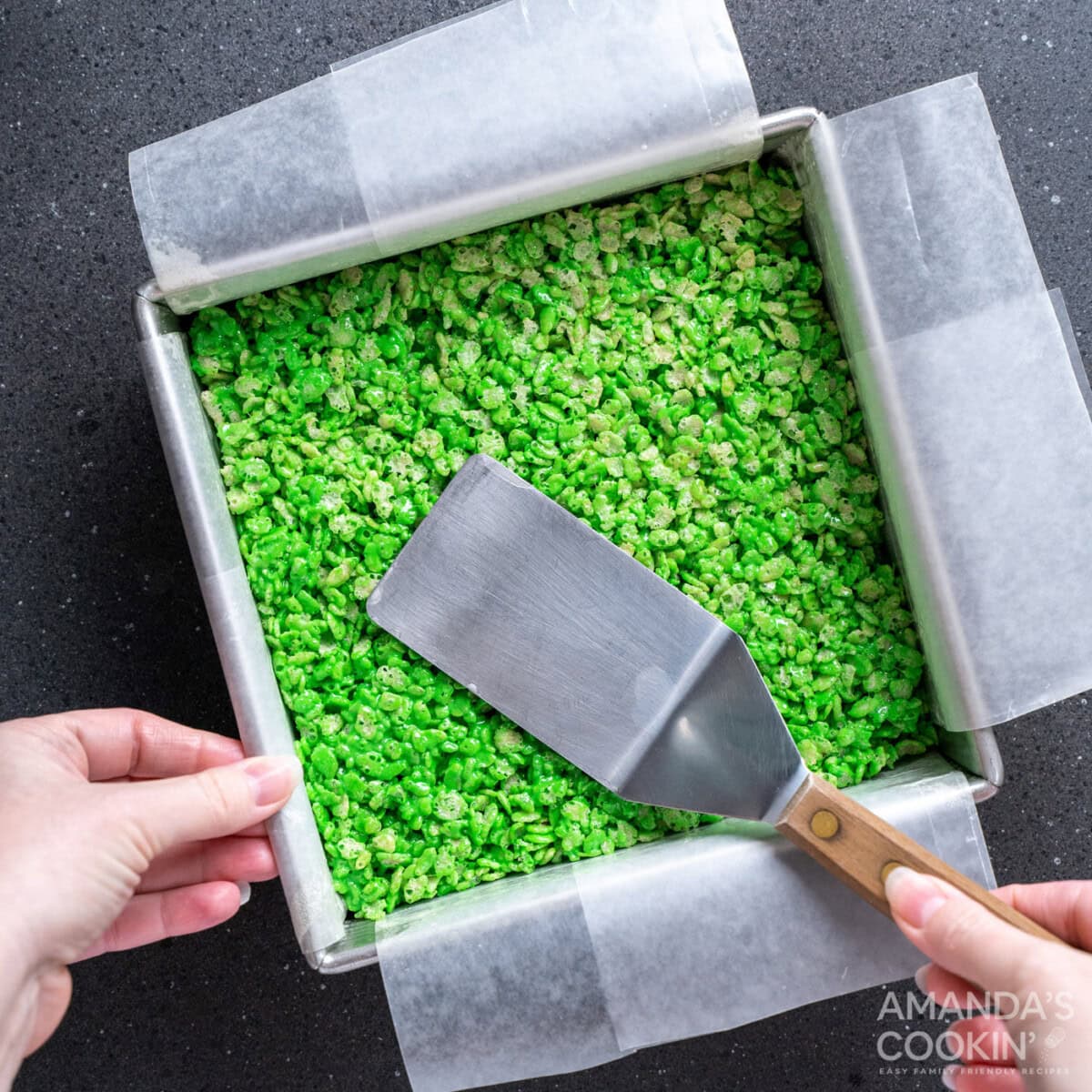 spatula patting flat rice krispie treats