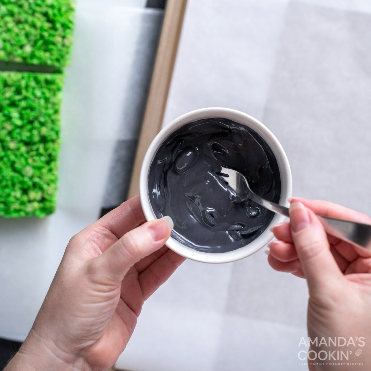 stirring melted black candy melts