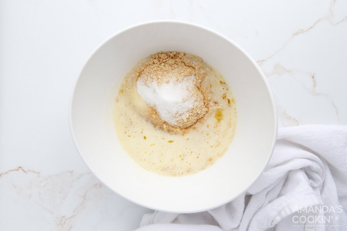 graham cracker crumbs, melted butter, and sugar in a mixing bowl
