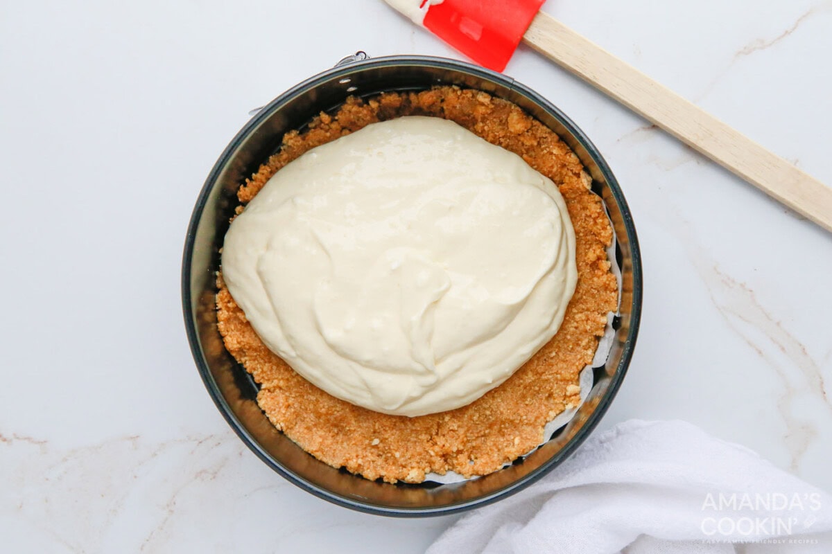 cheesecake mixture on top of graham cracker crust