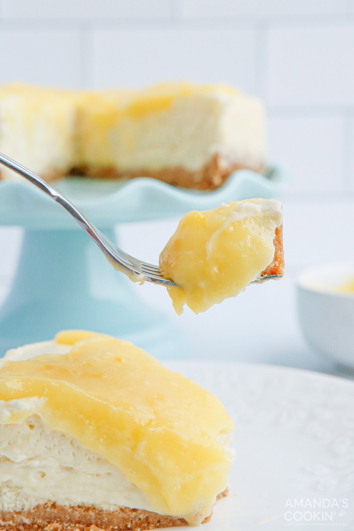fork full of Instant Pot Lemon Curd Cheesecake
