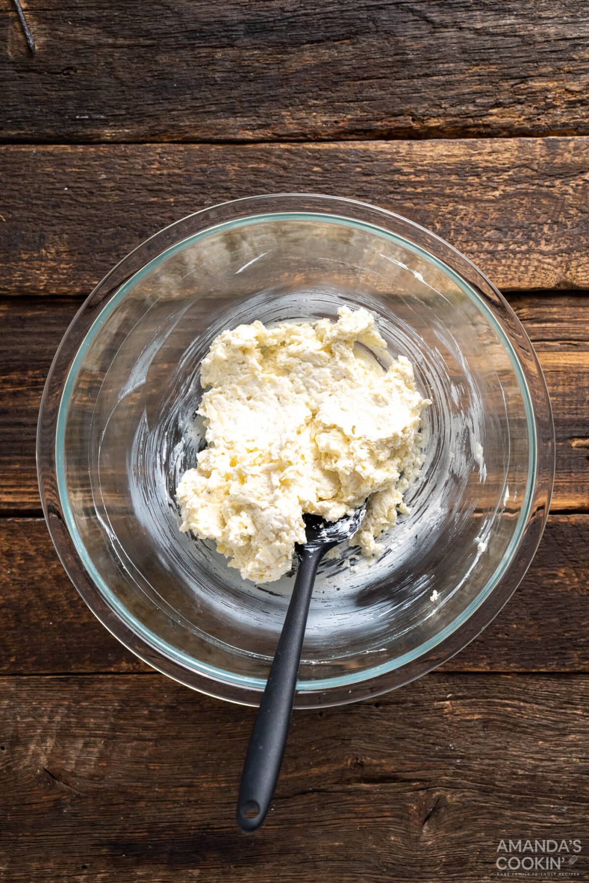 cream cheese, monterey jack cheese, and seasonings mixed in a bowl
