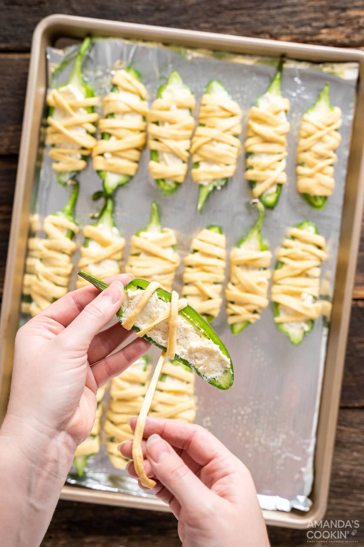 wrapping stuffed jalapenos with crescent dough