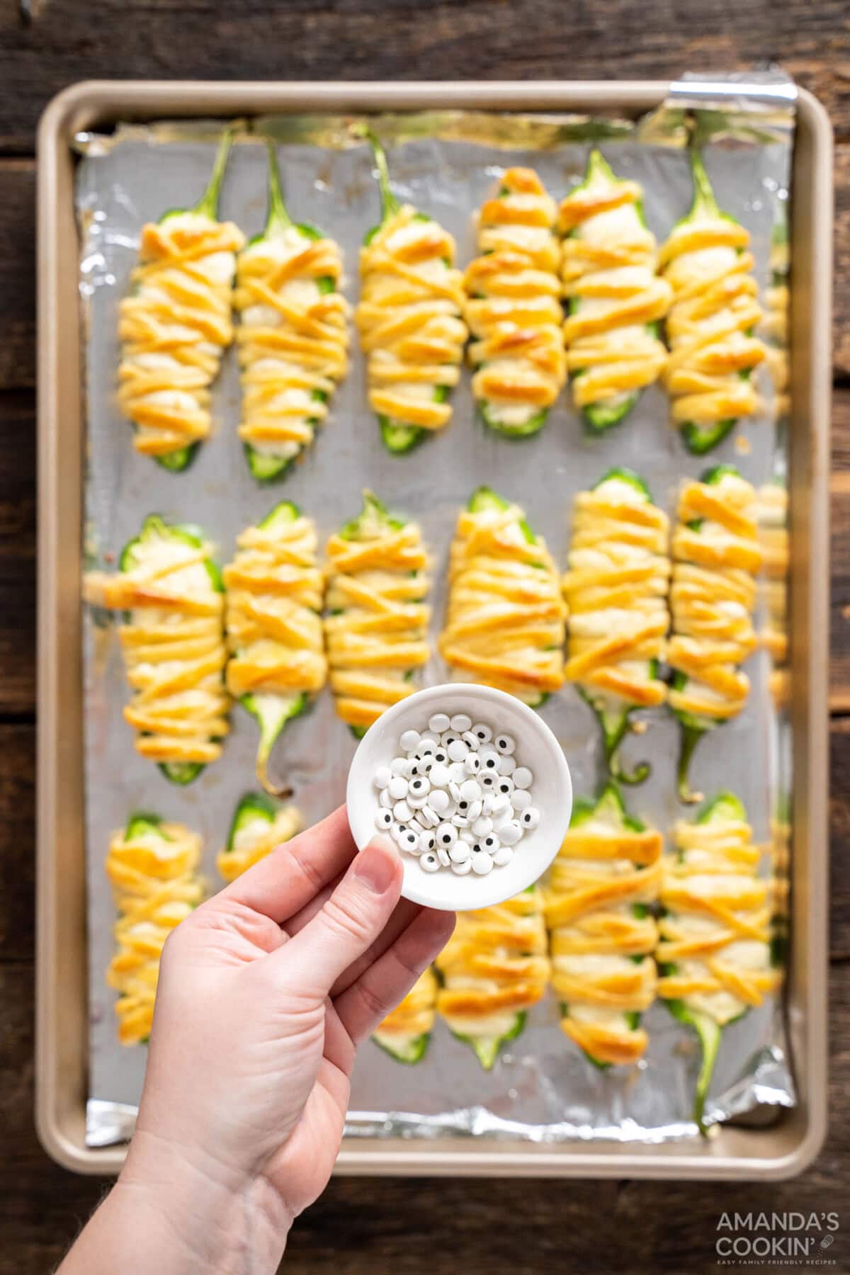 candy eyeballs over jalapeno popper mummies