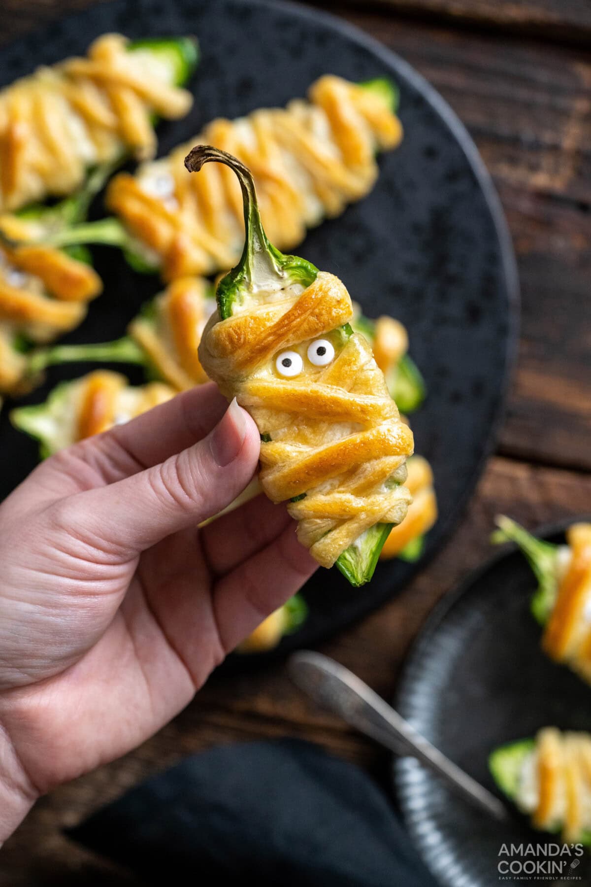 hand holding a Jalapeno Popper Mummy