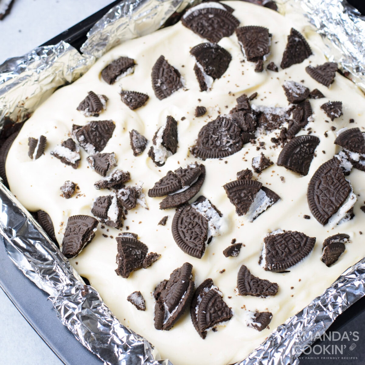 crushed Oreos over the top of cheesecake