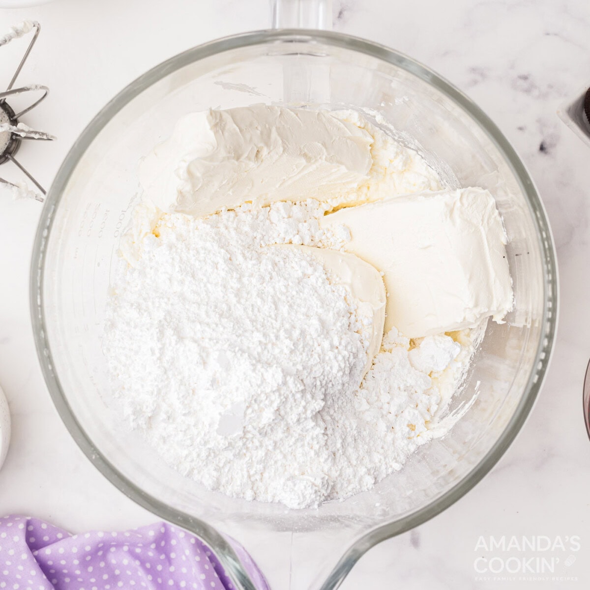 cream cheese with powdered sugar in a bowl