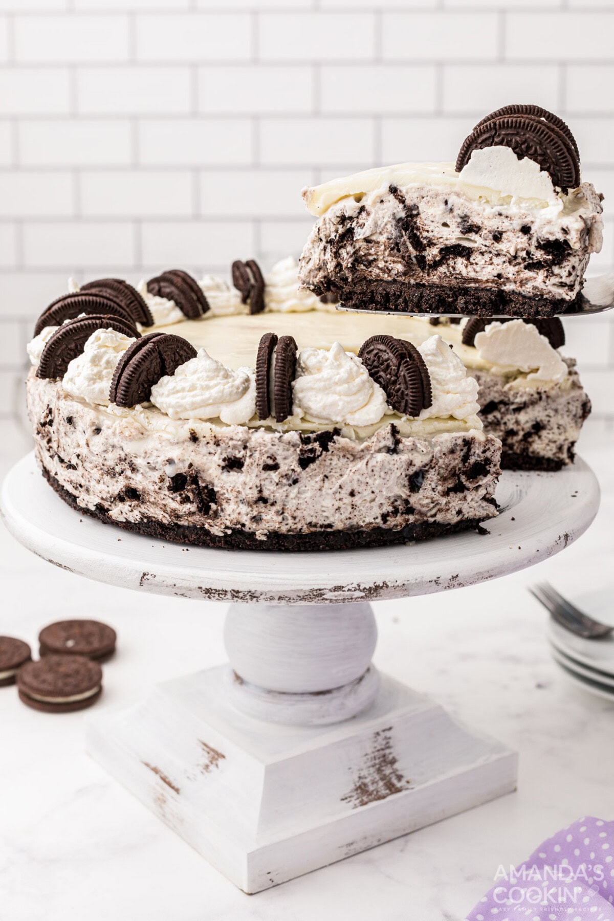 removing a slice of Oreo Cheesecake