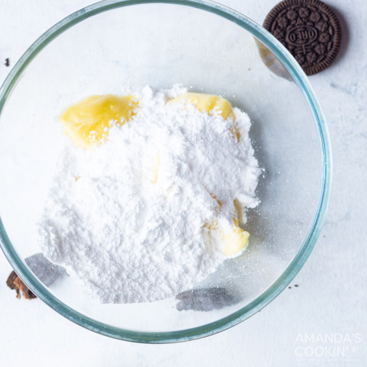 butter with powdered sugar in a bowl