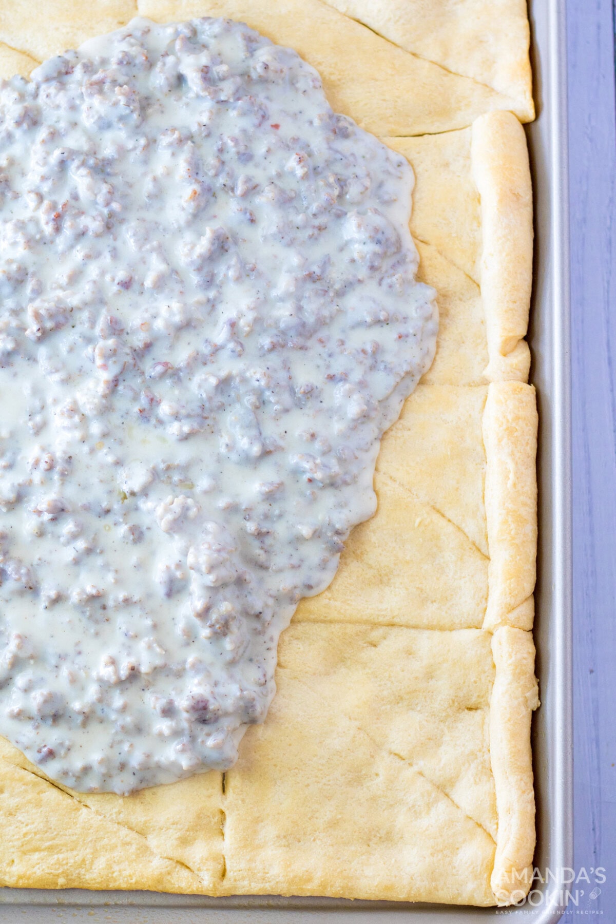 sausage gravy on top of crescent dough