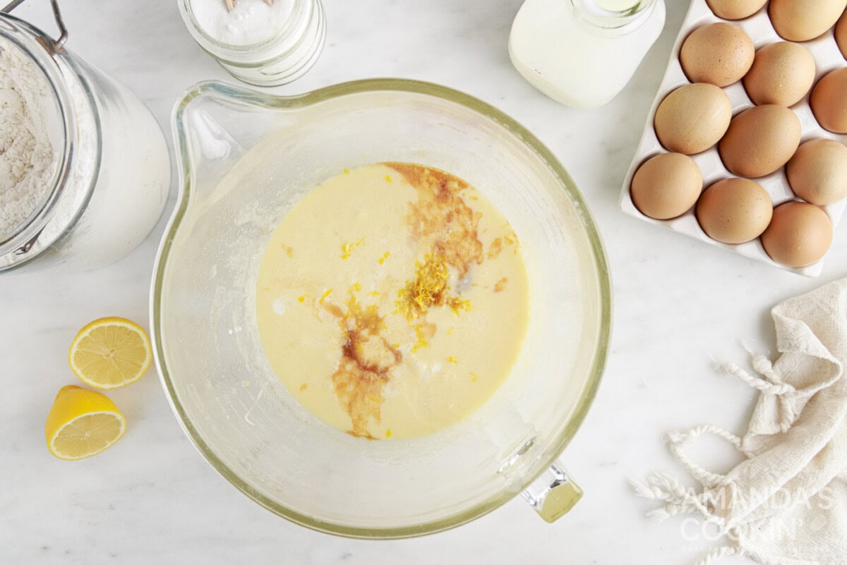 melted butter in a mixing bowl with sugar, vanilla, and