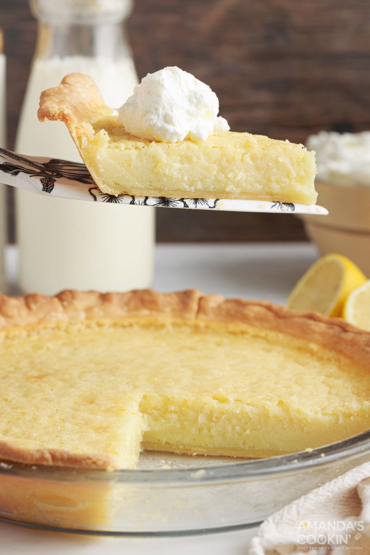 slice of Southern Buttermilk Pie being removed from pan