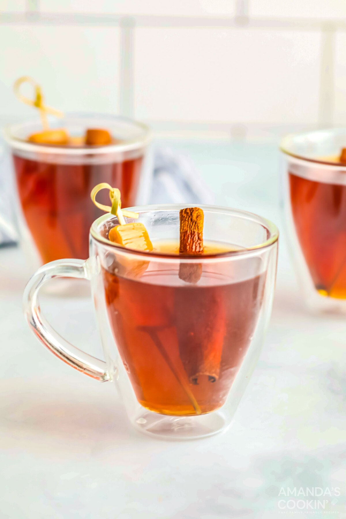 Spiked Caramel Apple Cider in glass mugs